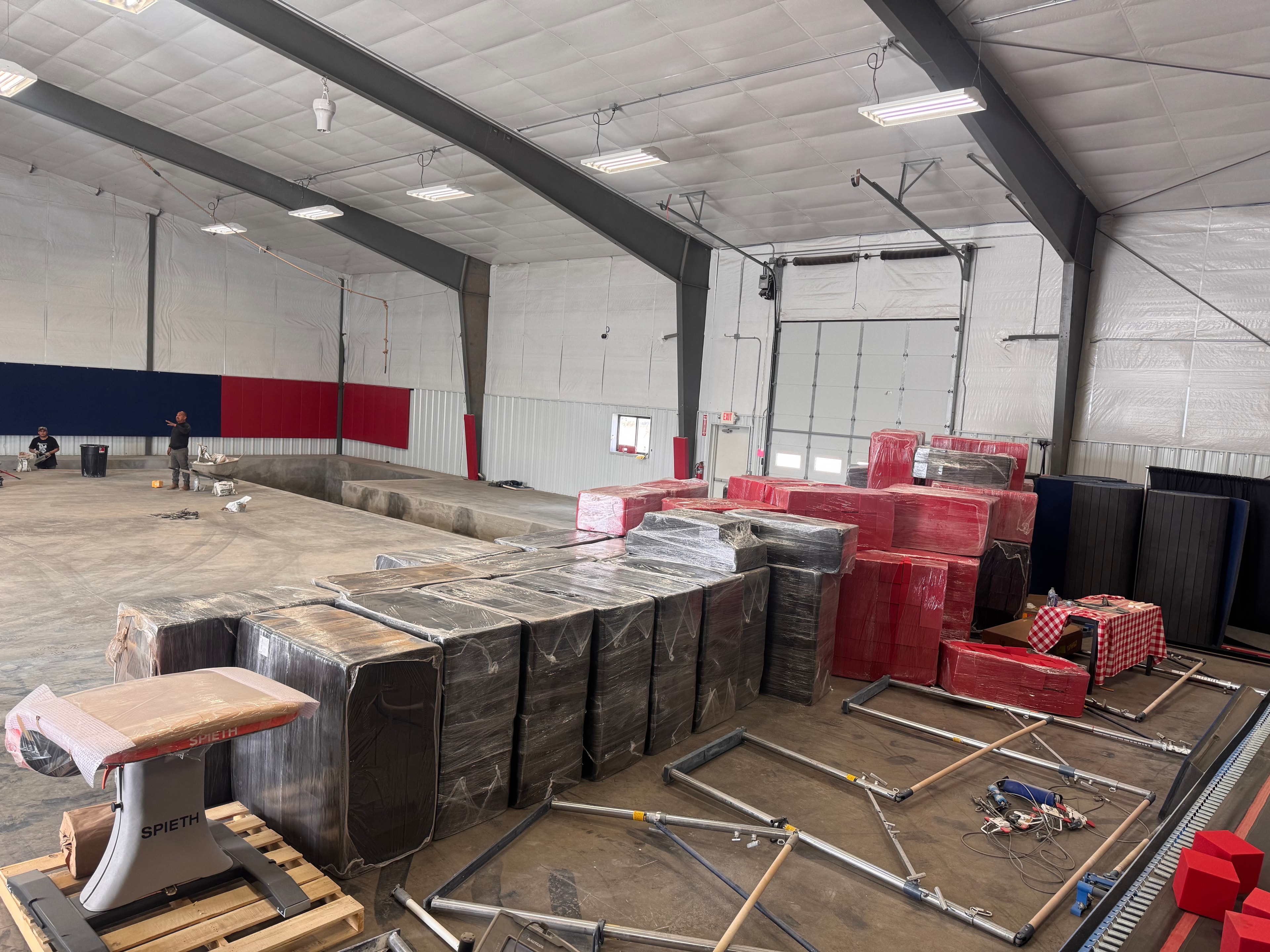 Equipment delivery day — Tumble Trak and foam blocks staged on the floor