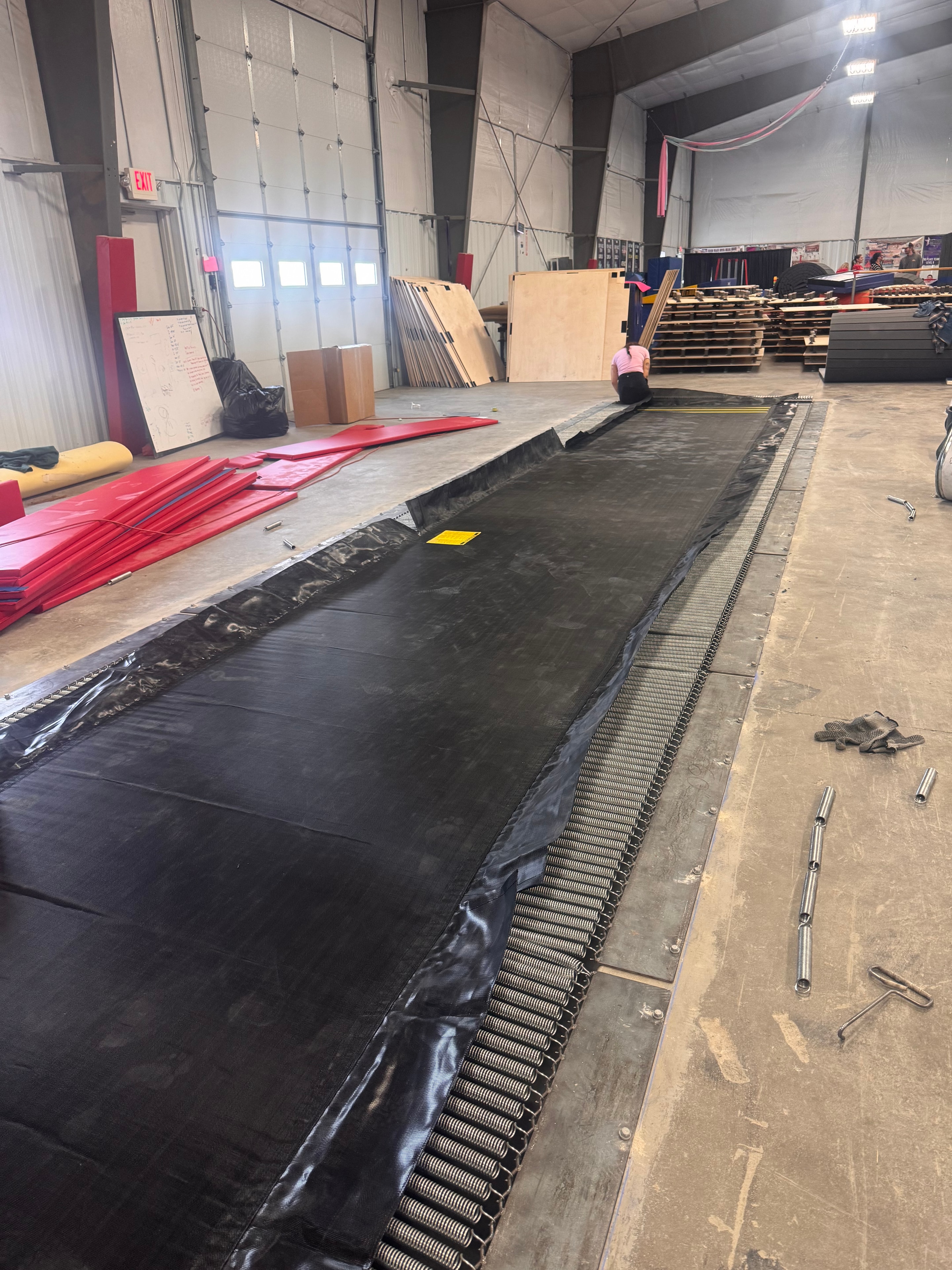 Inground Tumble Trak liner and springs being installed
